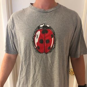 Heather gray ladybug Supreme shirt.